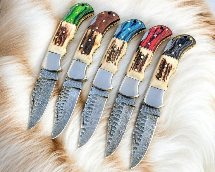 Damascus folding knife with stag horn and exotic wood handle, view 2