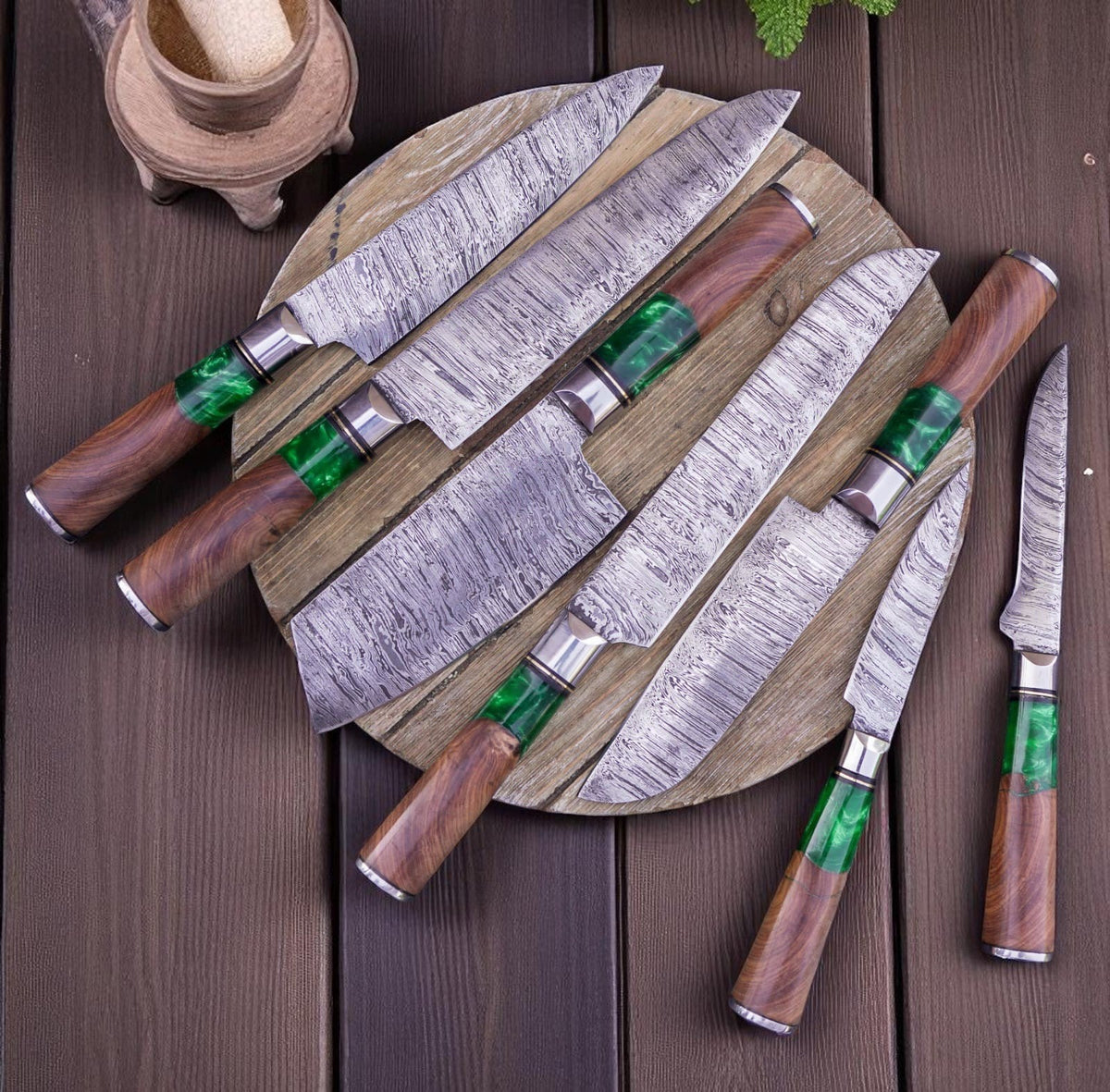Seven-piece Damascus knife set with green resin and rosewood handles