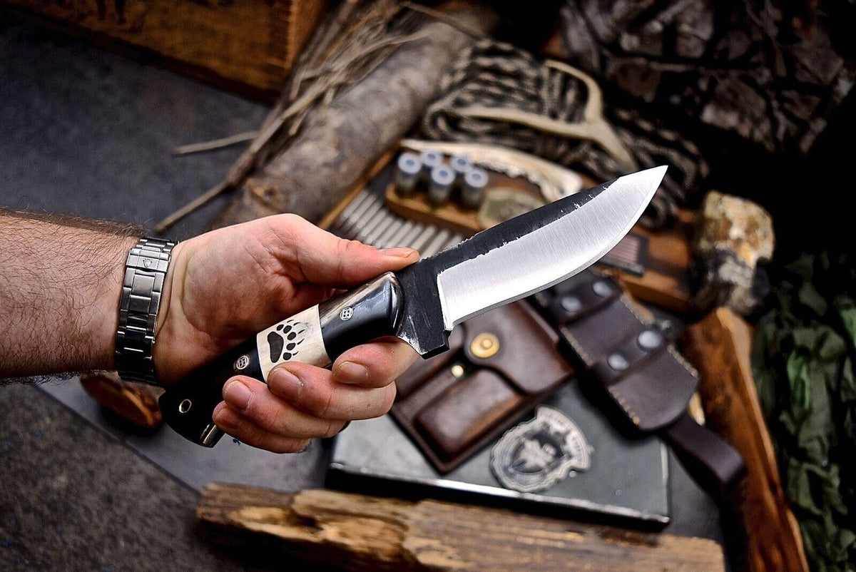 J2 steel skinning knife with black buffalo horn and cream camel bone handle