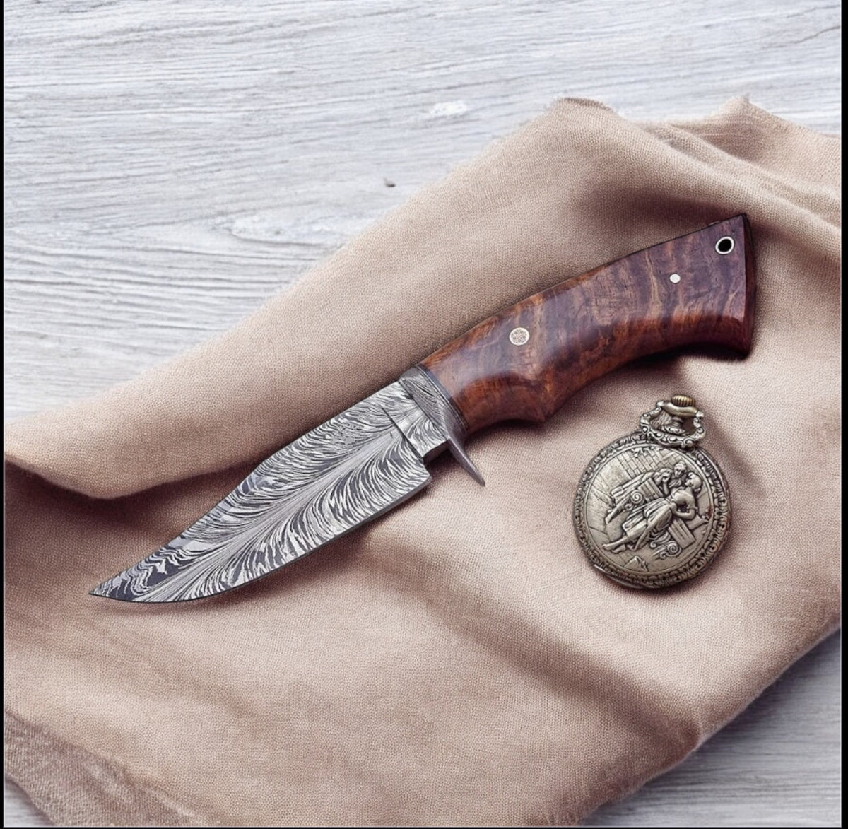 Damascus hunting knife with rosewood handle, Damascus guard, and belt loop sheath