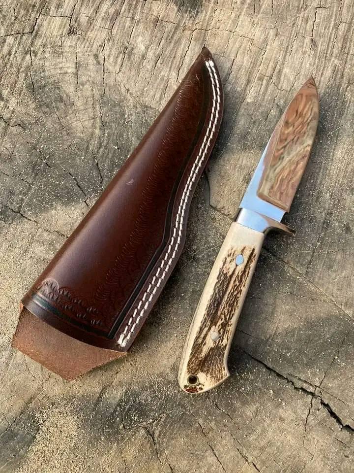 J2 steel knife with stag horn handle and leather belt sheath