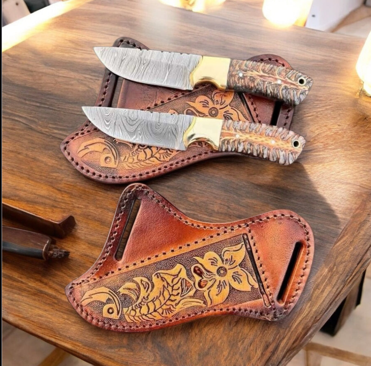 Damascus cowboy knife with pine cone resin handle, brass bolster and leather sheath