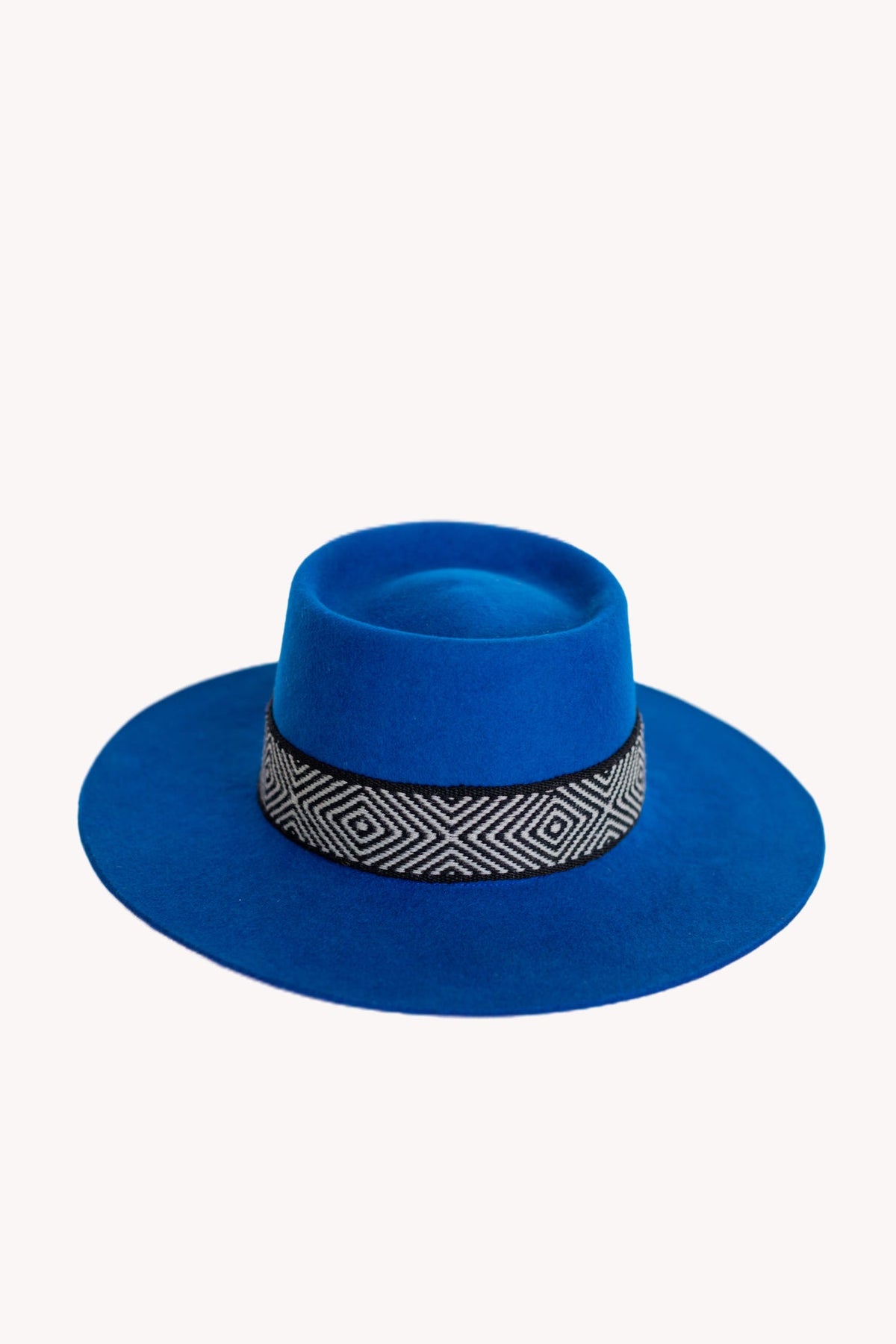 Electric blue alpaca wool felt bucket hat with a woven textile band