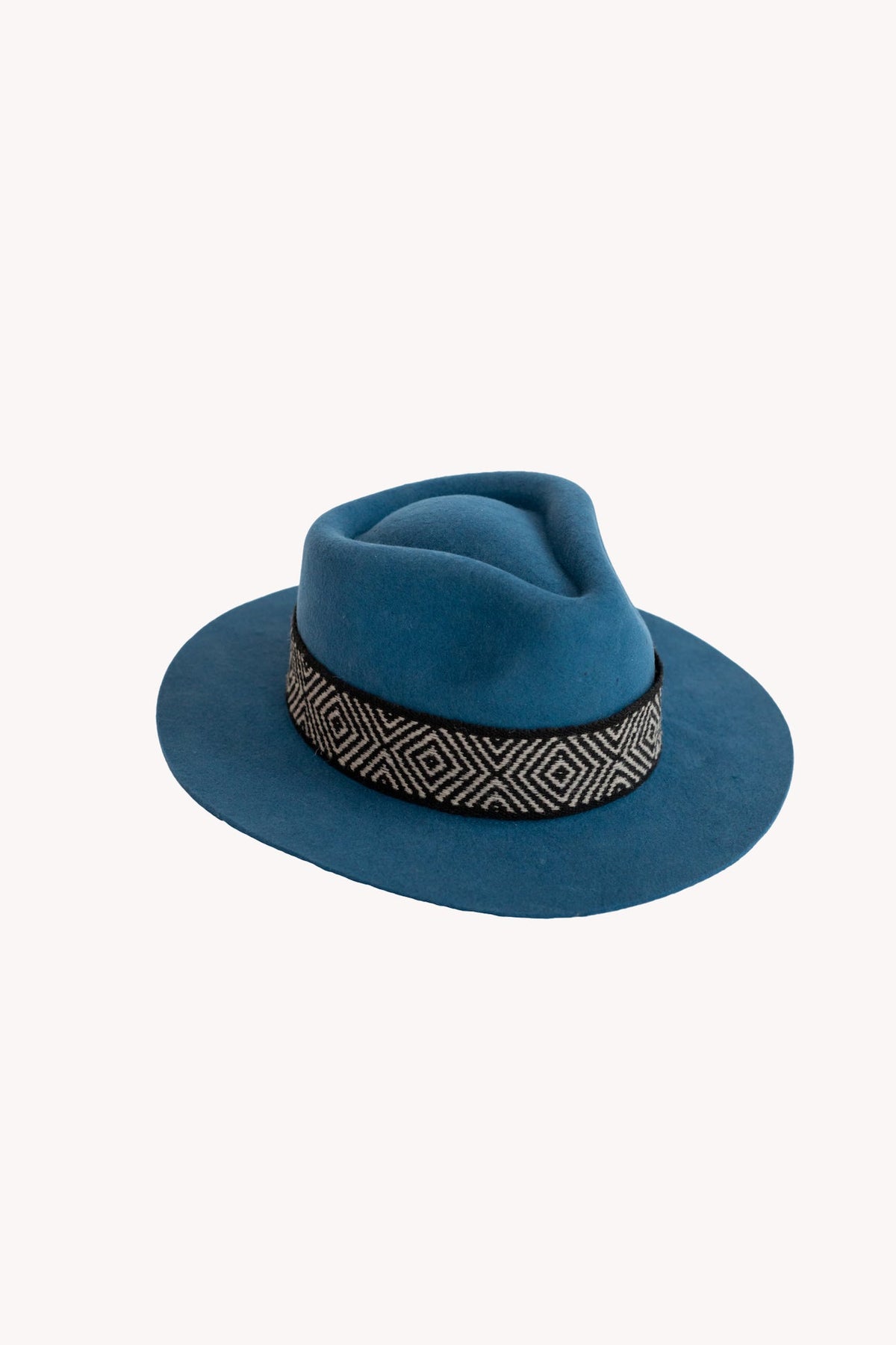 Denim blue alpaca wool felt fedora with a short brim and woven band
