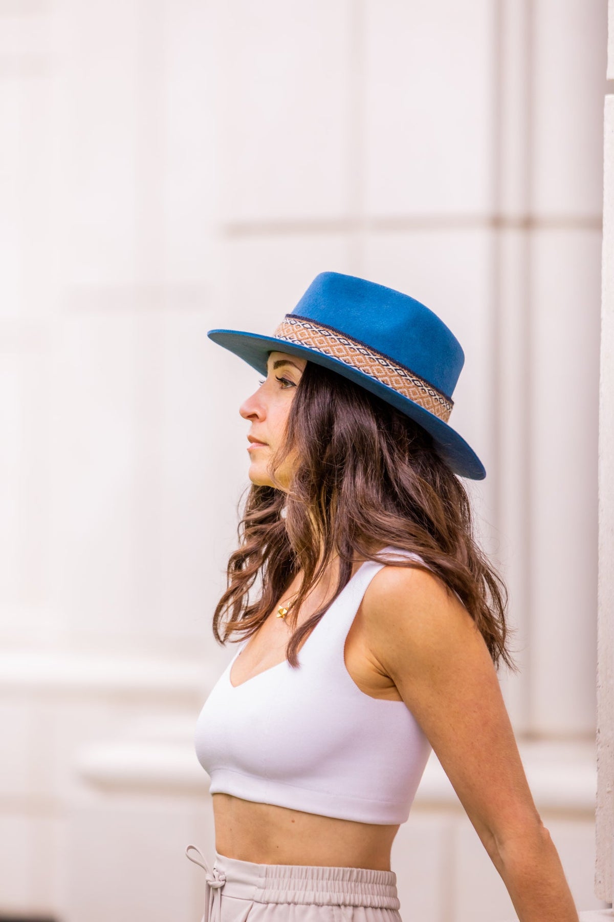Denim blue alpaca wool felt fedora with a short brim and woven band, view 3