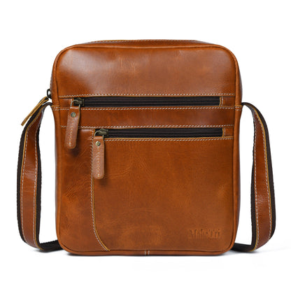 Tan buffalo leather compact messenger bag with front zip pockets, view 3
