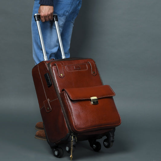 Cherry red-brown leather carry-on trolley bag with four wheels and handle