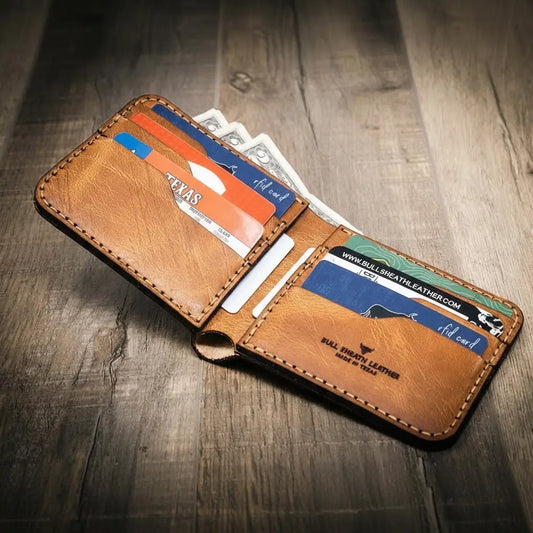 Saddle tan leather bifold wallet open to show eight card slots