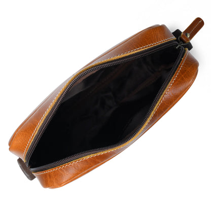 Tan buffalo leather compact messenger bag with front zip pockets, view 4
