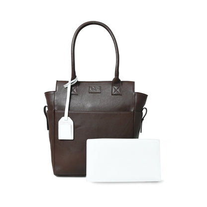 Brown buffalo leather tote with white border trim and hanging tag