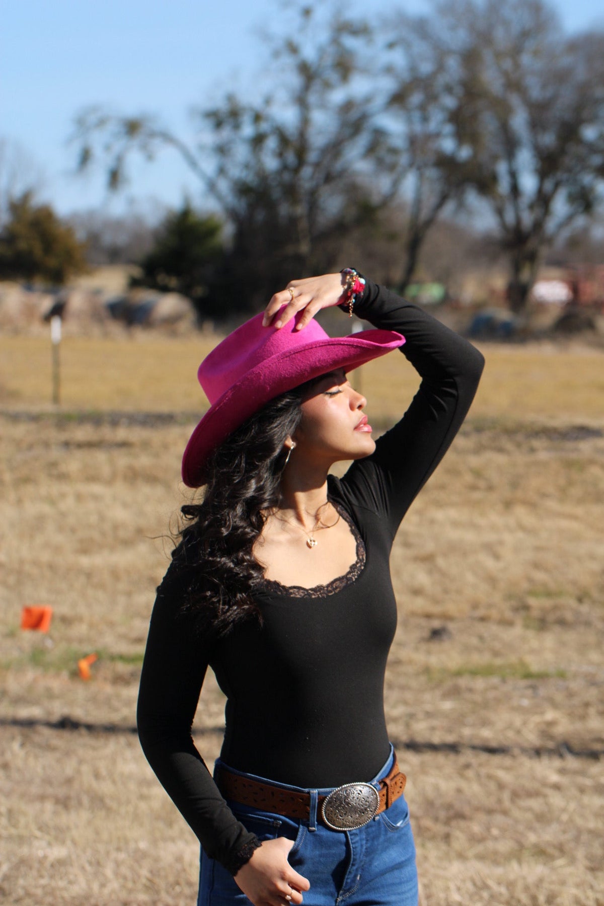Magenta vegan suede cowboy hat with a lifted brim and faux leather band, view 2