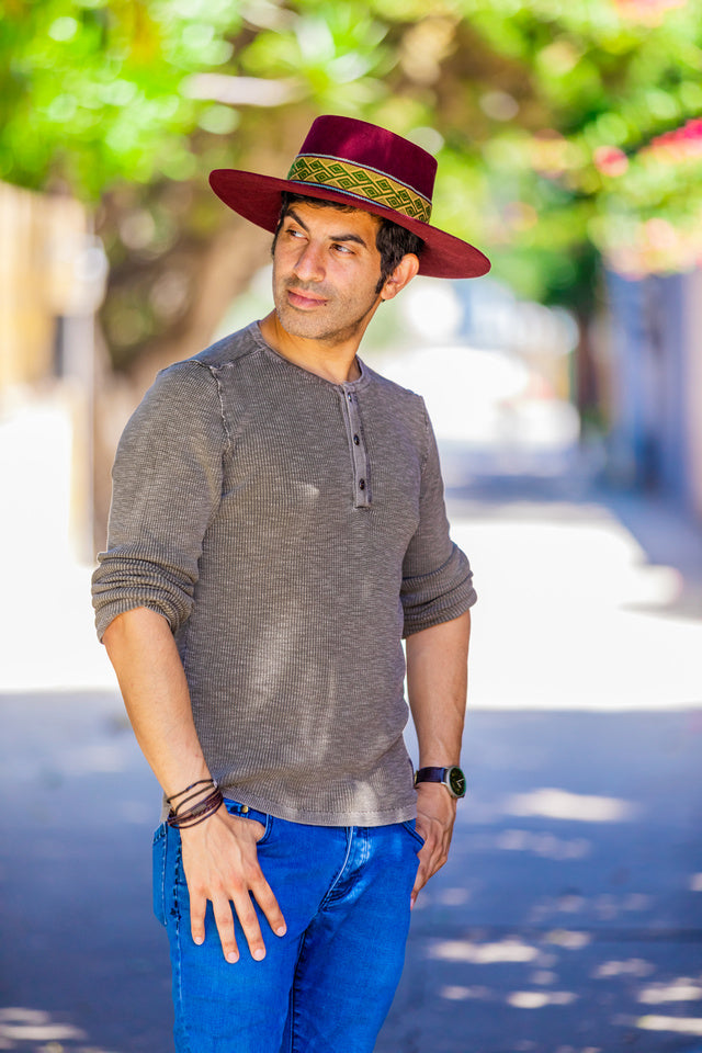 Maroon alpaca wool felt bucket hat with a woven textile band, view 4