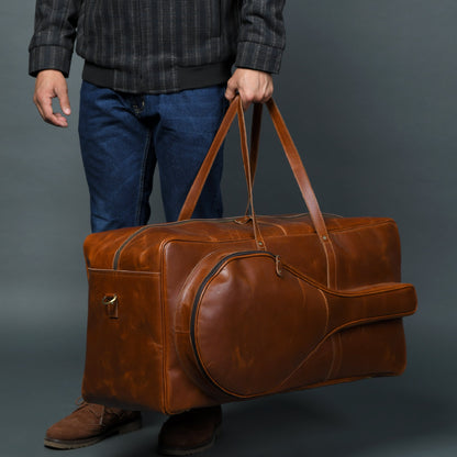 Tan buffalo leather duffle bag with top handle and shoulder strap, view 3