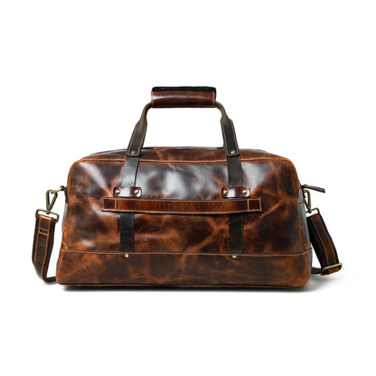Saddle tan buffalo leather carry-on duffle with black handles and shoulder strap, view 4