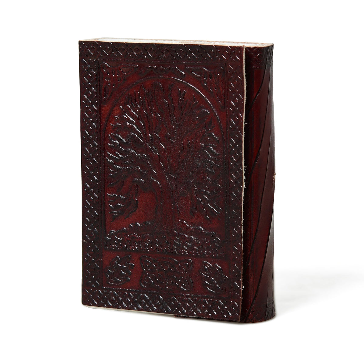 Leather journal with embossed tree motif and leather string closure