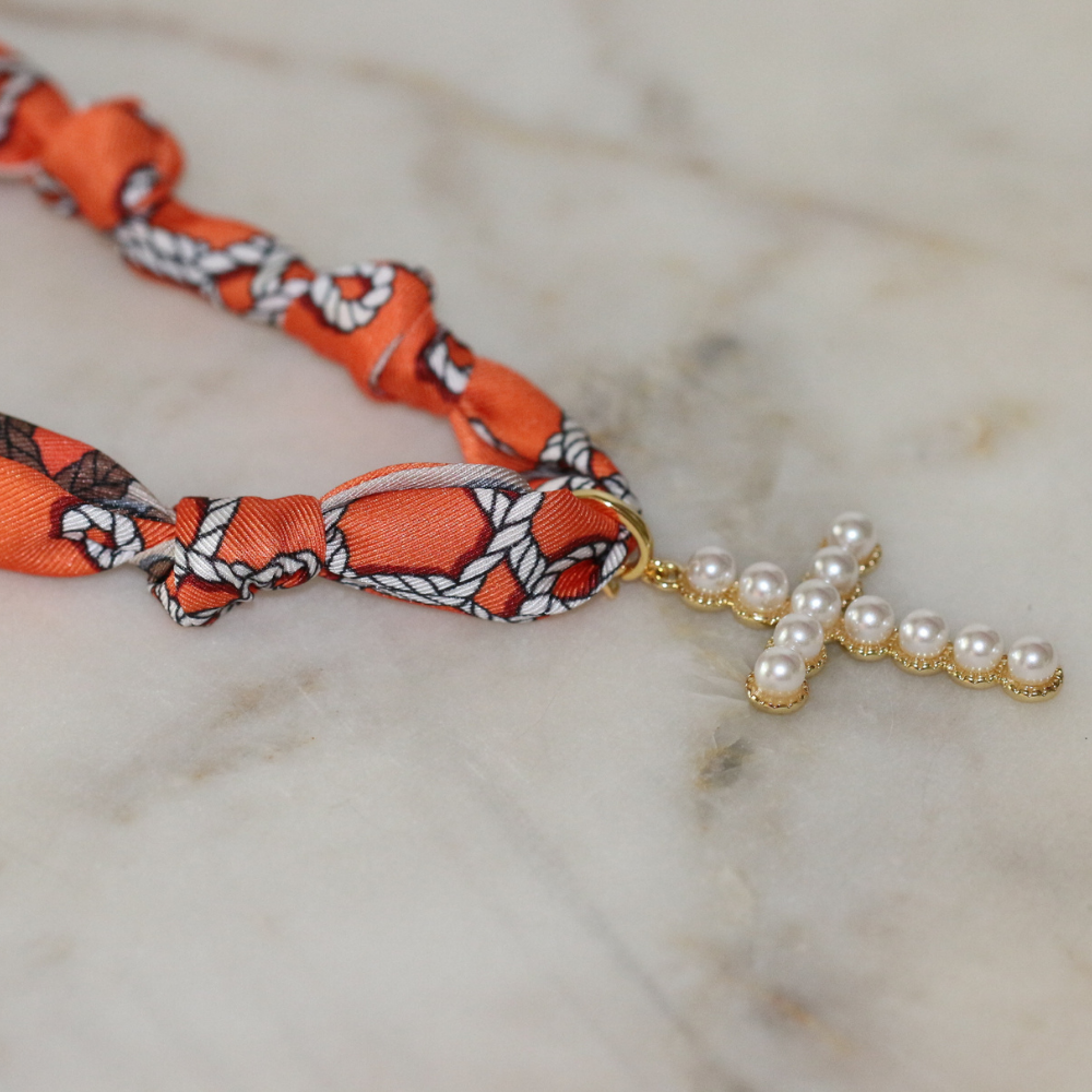 Orange scarf necklace with gold framed pearl cross, view 2