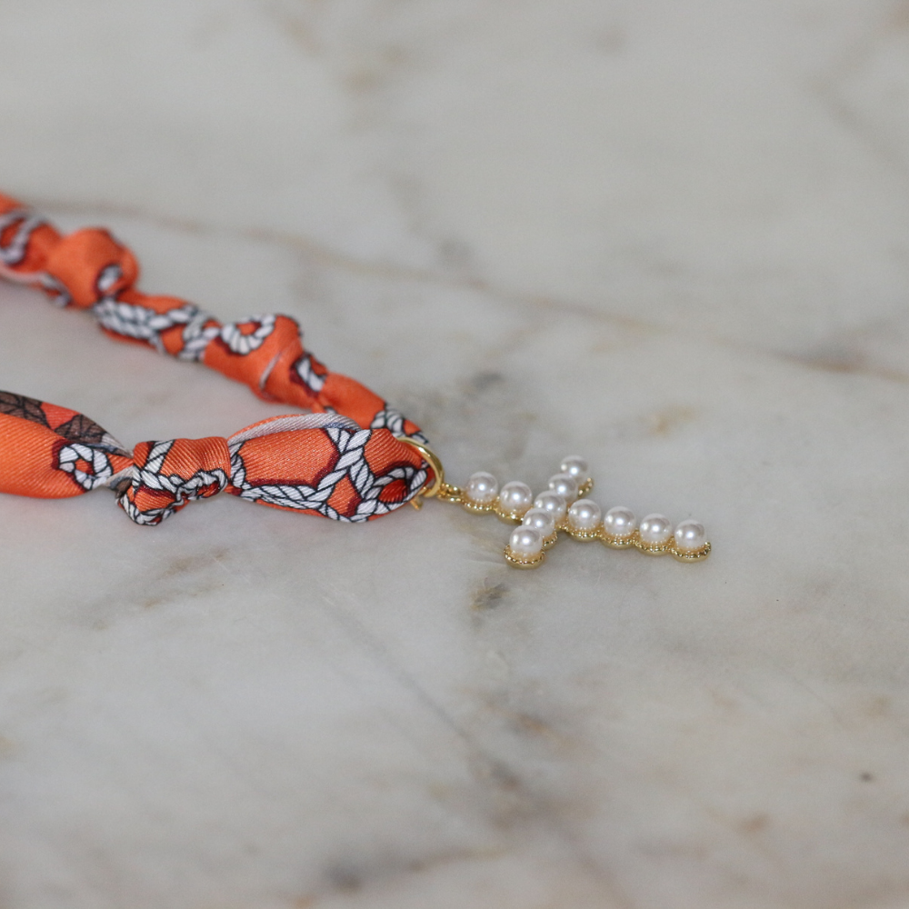 Orange scarf necklace with gold framed pearl cross, view 3