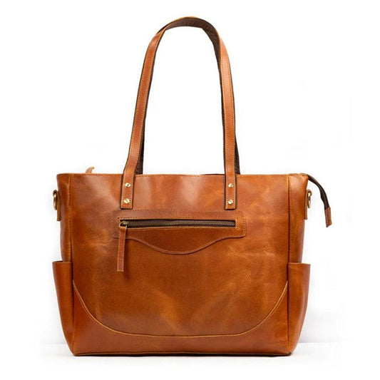 Tan full-grain leather tote bag with top handles and zip pockets