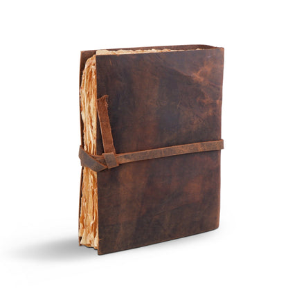 Dark brown leather journal with embossed tree and wrap strap, view 2