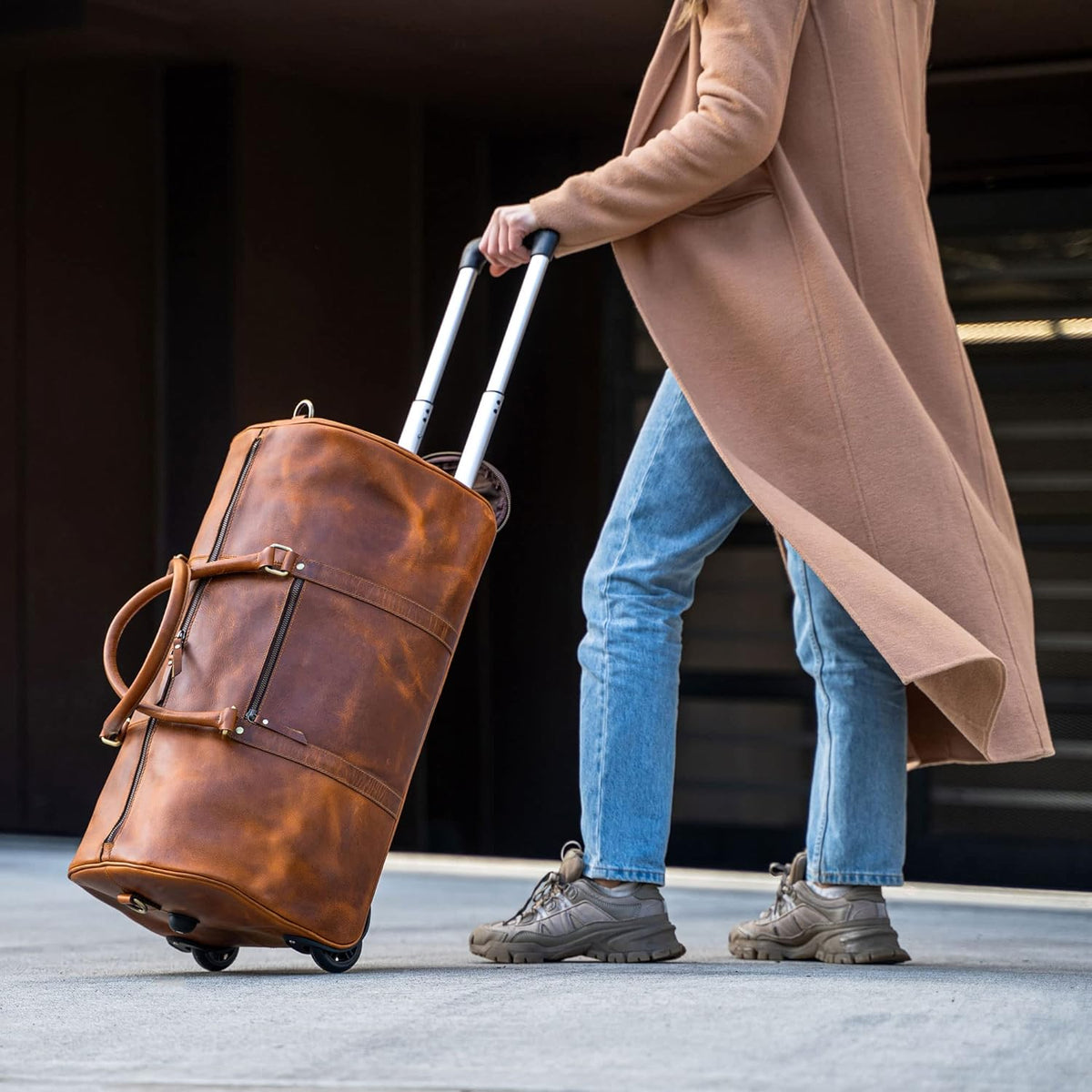 Tan buffalo leather trolley bag with wheels and top handle, view 2