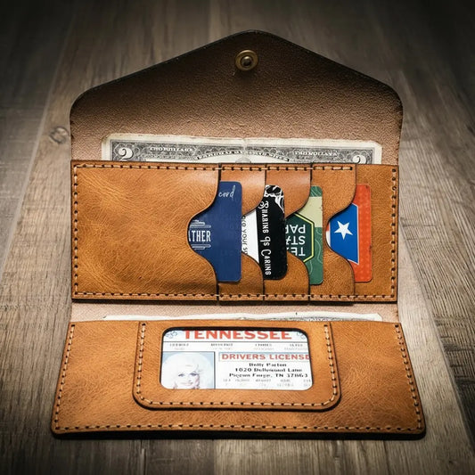 Saddle tan wrap-around leather clutch wallet folded flat