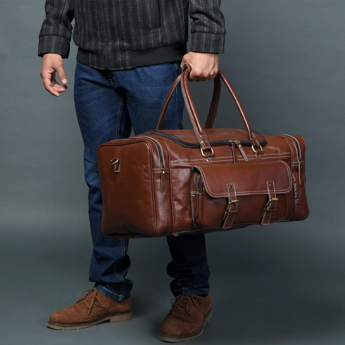 Vintage brown buffalo leather duffle bag with brass buckles and exterior pockets, view 2