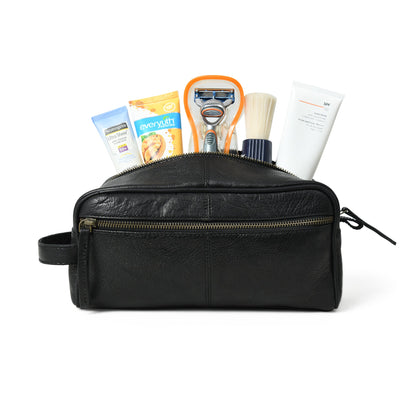 Black leather single-section toiletry bag with zip closure, view 2