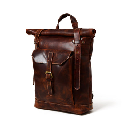 Brown buffalo leather roll top backpack with buckled front pocket, view 2