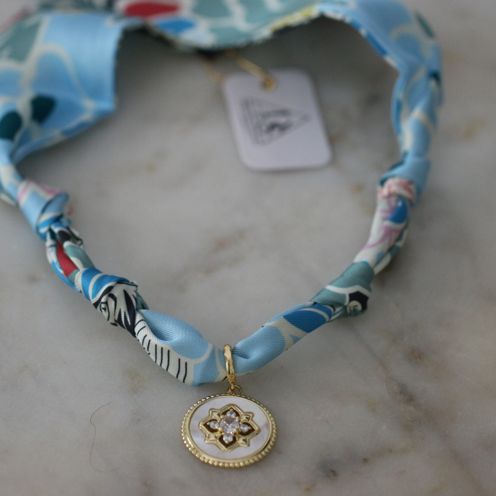Blue and seafoam scarf necklace with white enamel floral charm