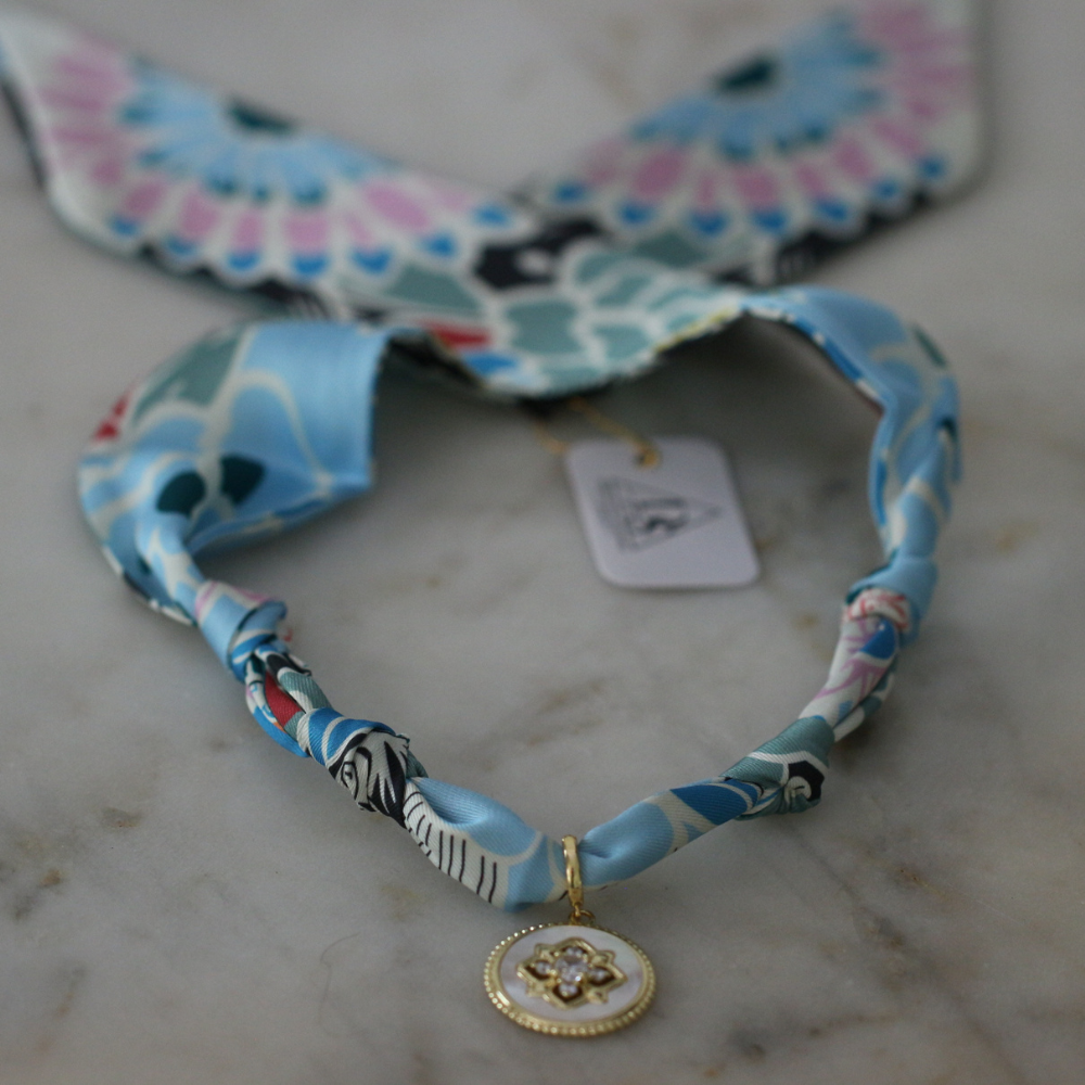 Blue and seafoam scarf necklace with white enamel floral charm, view 2
