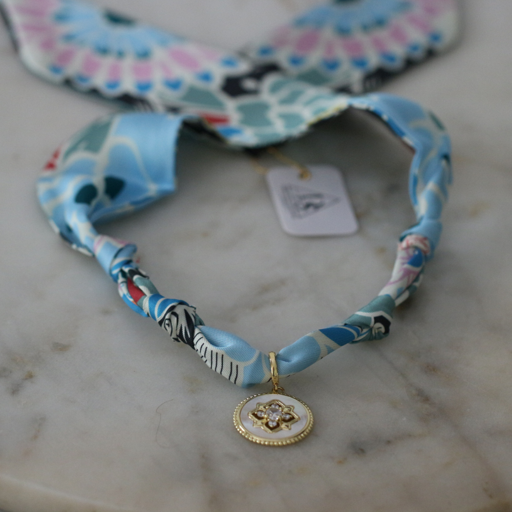 Blue and seafoam scarf necklace with white enamel floral charm, view 3