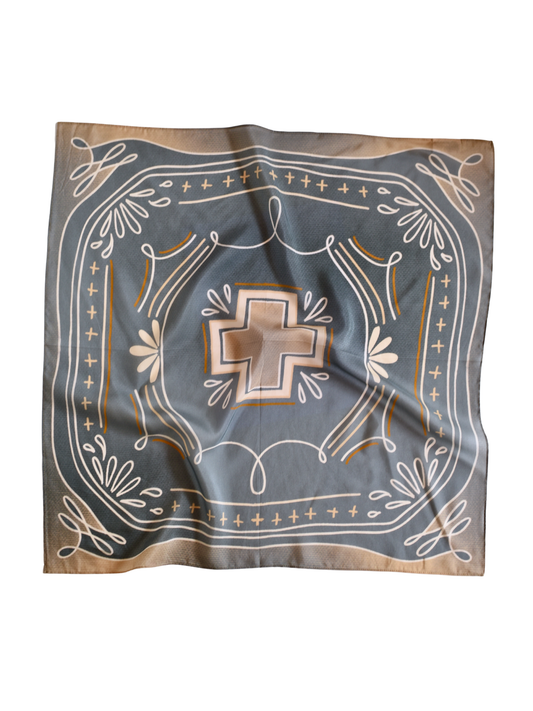 Dusty blue wild rag with a center cross and boot-stitch sketch pattern