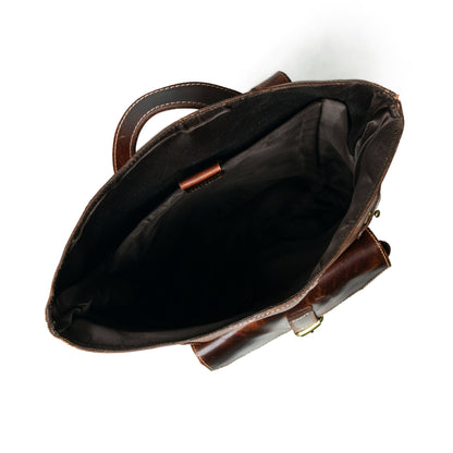 Brown buffalo leather roll top backpack with buckled front pocket, view 4