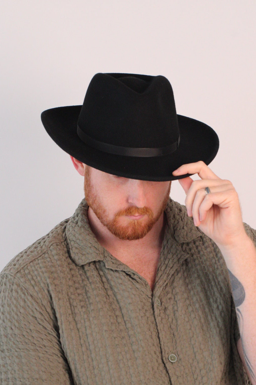 Black wool felt hat with a teardrop crown and a 3-inch curved brim, view 2