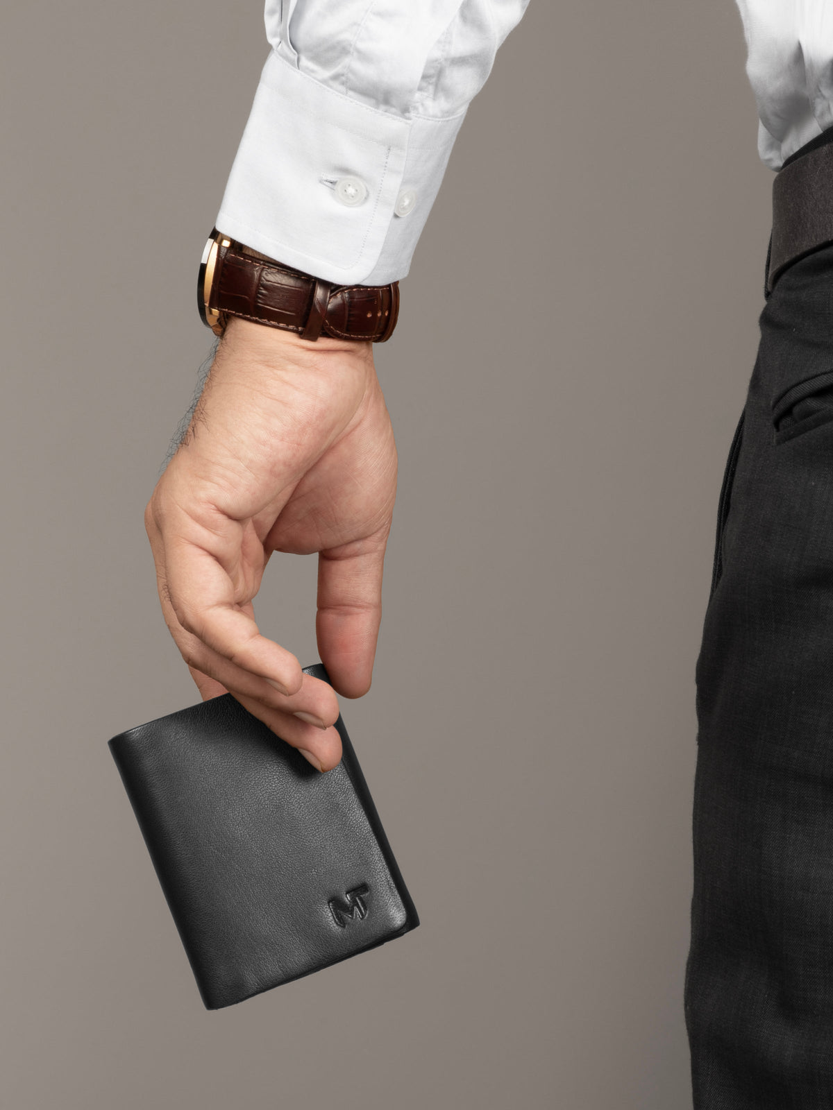 Black leather trifold wallet with card slots and coin pocket, view 3