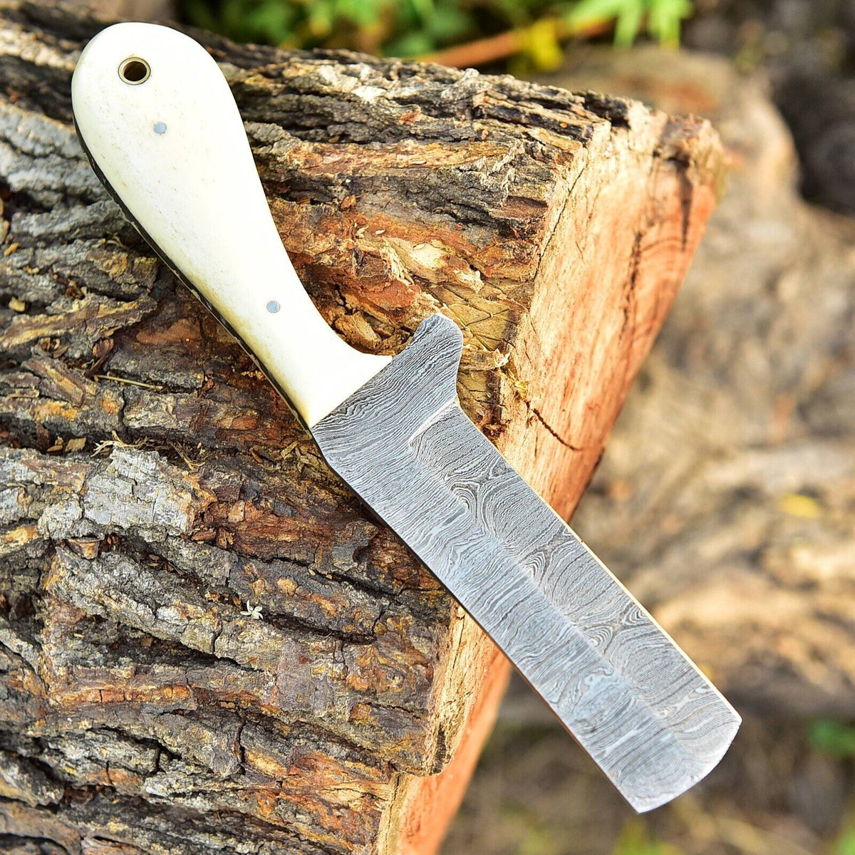Damascus belt knife with a camel bone handle and Western leather sheath