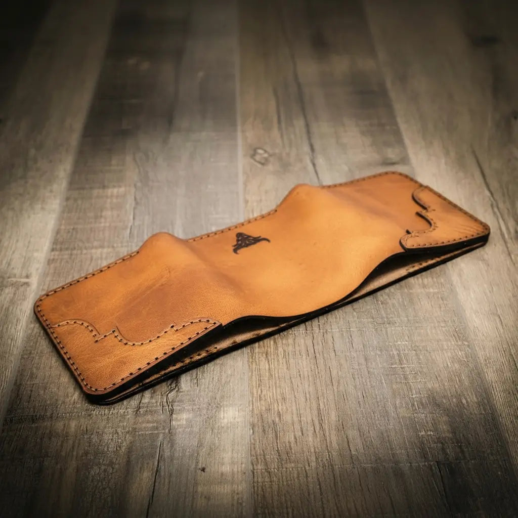 Saddle tan western tooled leather trifold wallet