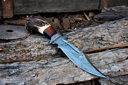 Damascus bowie knife with stag crown pommel, rosewood grip and leather sheath