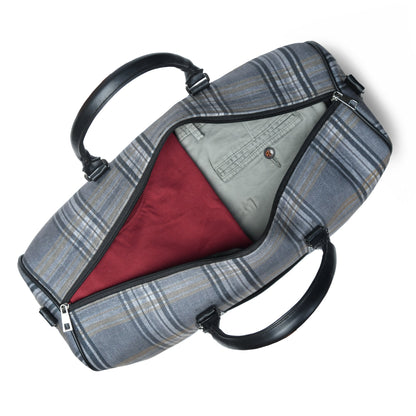 Grey plaid canvas duffle bag with leather trim and shoulder strap, view 4