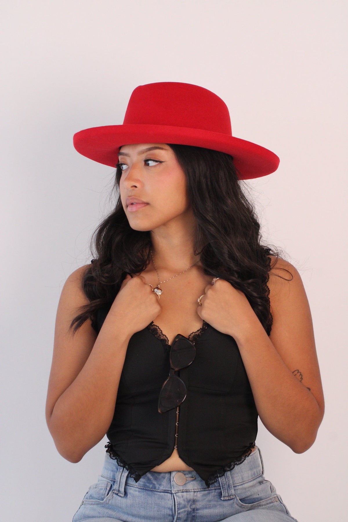 Cherry red wool felt hat with a teardrop crown and pencil-rolled brim