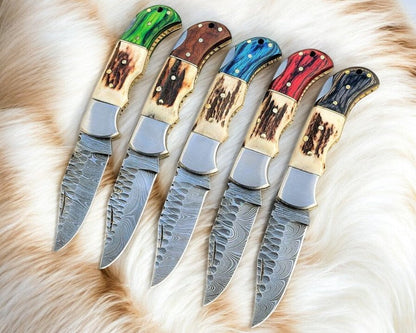 Damascus folding knife with stag horn and exotic wood handle, view 2