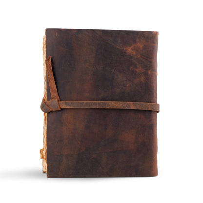 Dark brown leather journal with embossed tree and wrap strap, view 4