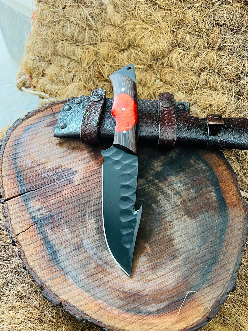 J2 steel skinning knife with wangi wood handle and leather sheath