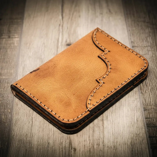 Saddle tan western tooled vertical leather wallet