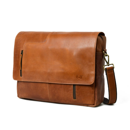 Tan buffalo leather crossbody bag with brass clasp flap