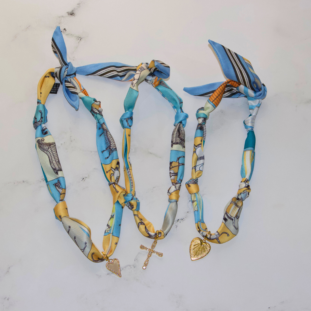 Blue horse print silk scarf necklace with gold charm, view 2