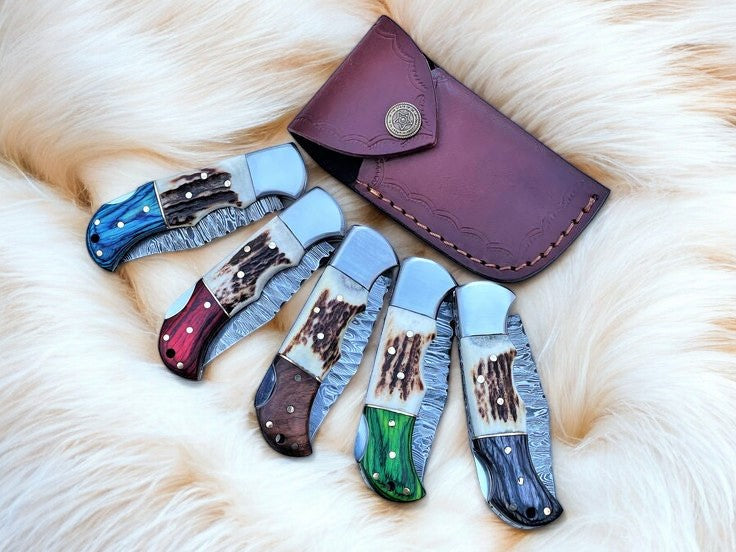 Damascus folding knife with stag horn and exotic wood handle
