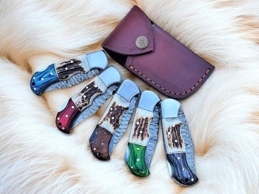 Damascus folding knife with stag horn and exotic wood handle