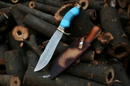 Damascus hunting knife with wood and bone handle, brass bolster and leather sheath