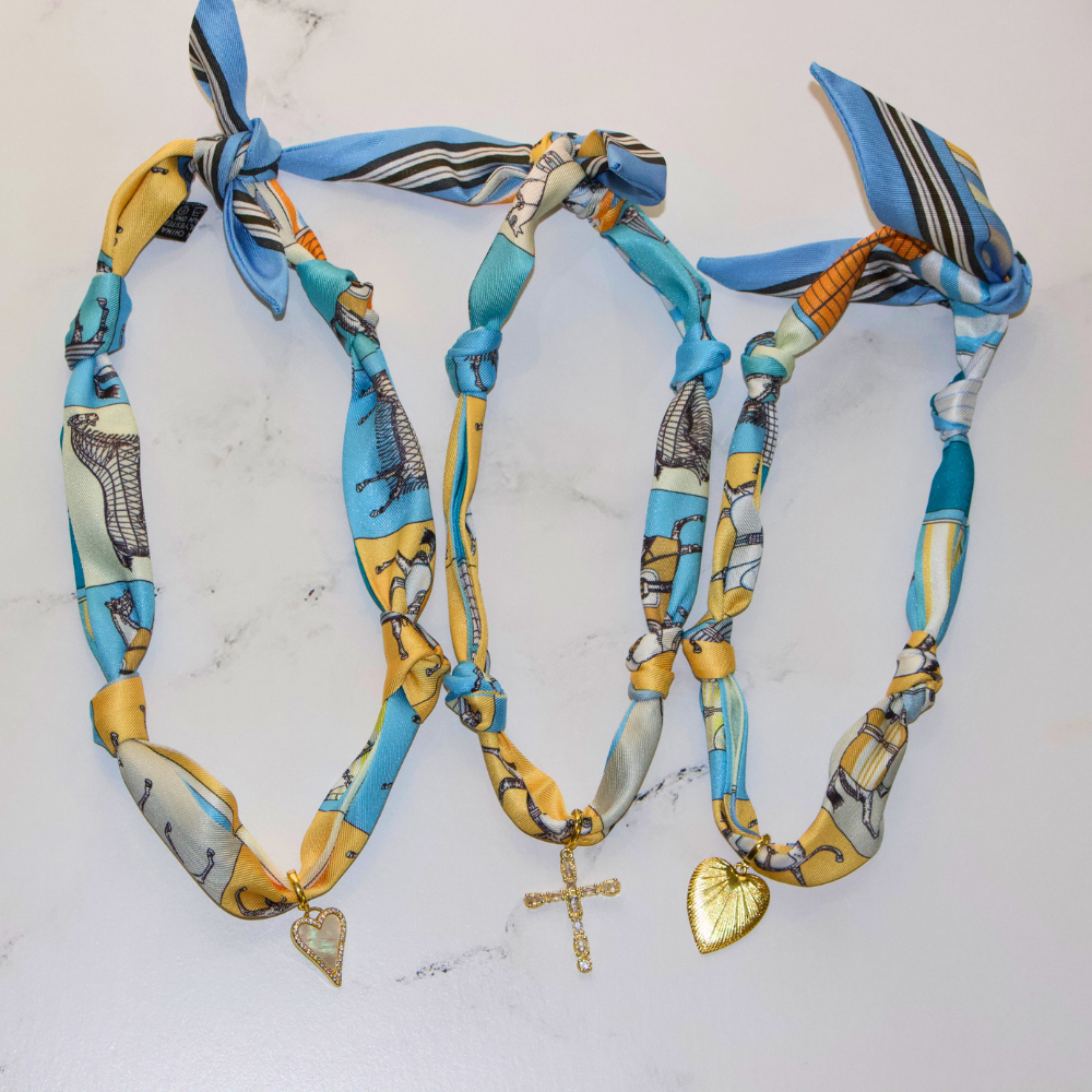 Blue horse print silk scarf necklace with gold charm, view 3
